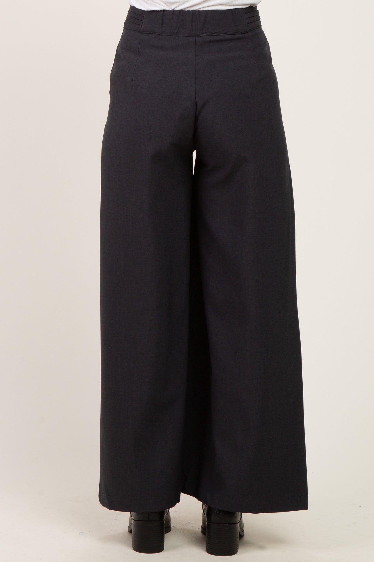 maternity wear navy wide-leg trousers shown from the back