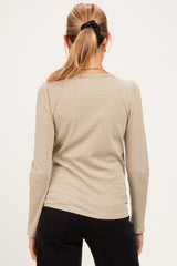 woman wearing a striped long sleeve maternity top, viewed from the back