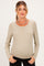 woman wearing a striped long sleeve maternity top with button detail and a visible baby bump