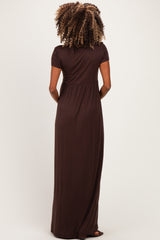 woman wearing a brown short sleeve maternity maxi dress, showing the back view with a relaxed fit