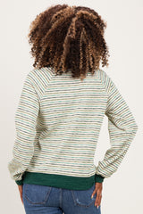 woman wearing a green and white striped maternity sweatshirt with long sleeves and a rounded neckline, showing a baby bump