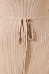 beige ribbed sweater dress with a tied waist detail