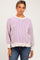 woman wearing a striped light purple and beige maternity sweater with relaxed fit and balloon sleeves