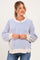 woman wearing a blue and white striped maternity sweater with a visible baby bump