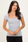 woman wearing a grey short sleeve fitted top with a square neckline and a slight ribbed texture