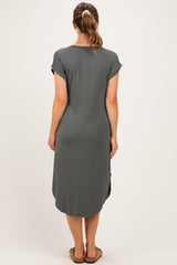 woman wearing a grey maternity dress with short sleeves and a knee-length cut, shown from the back