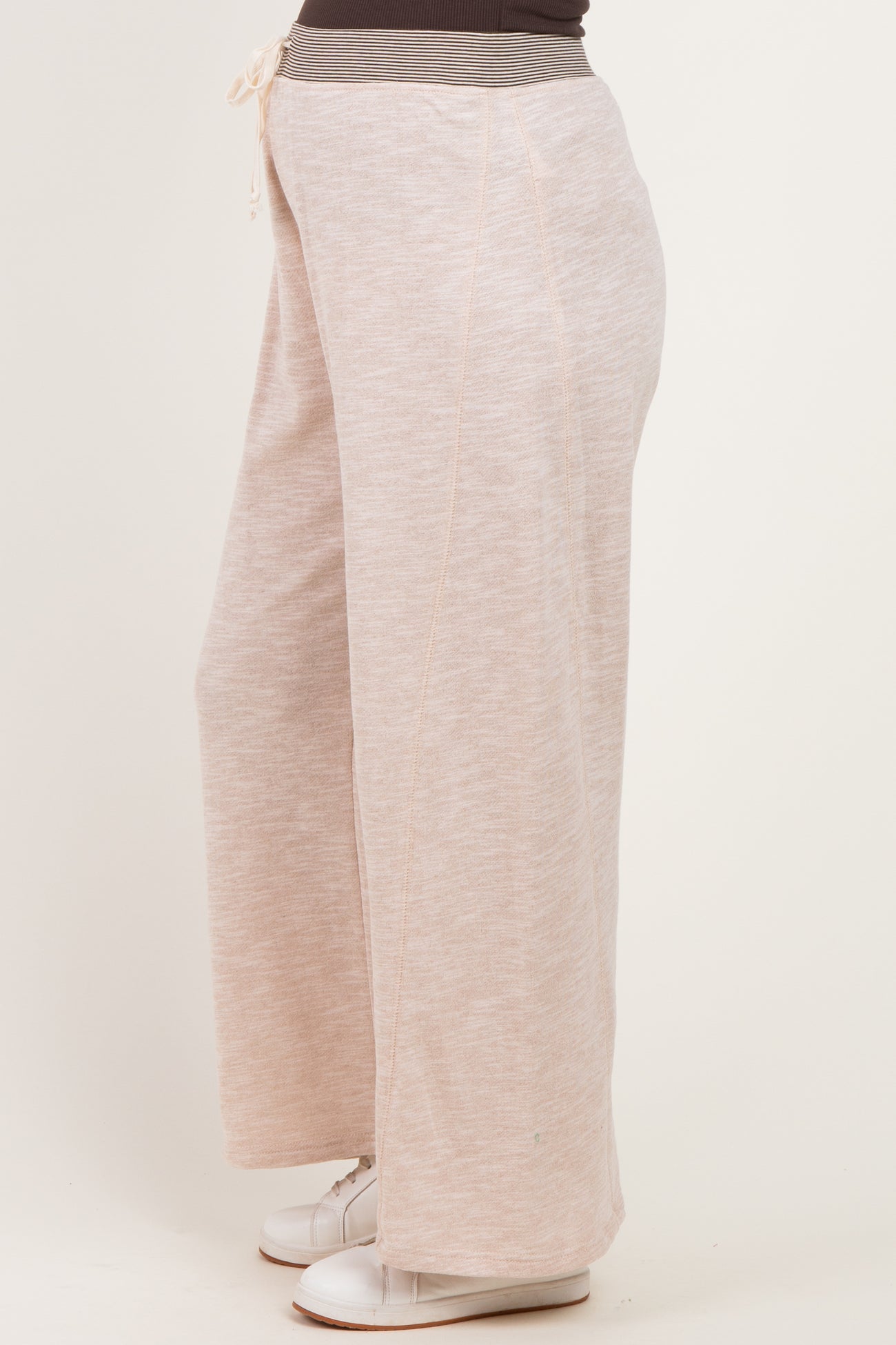 woman wearing light pink wide-leg maternity sweatpants with a drawstring waistband