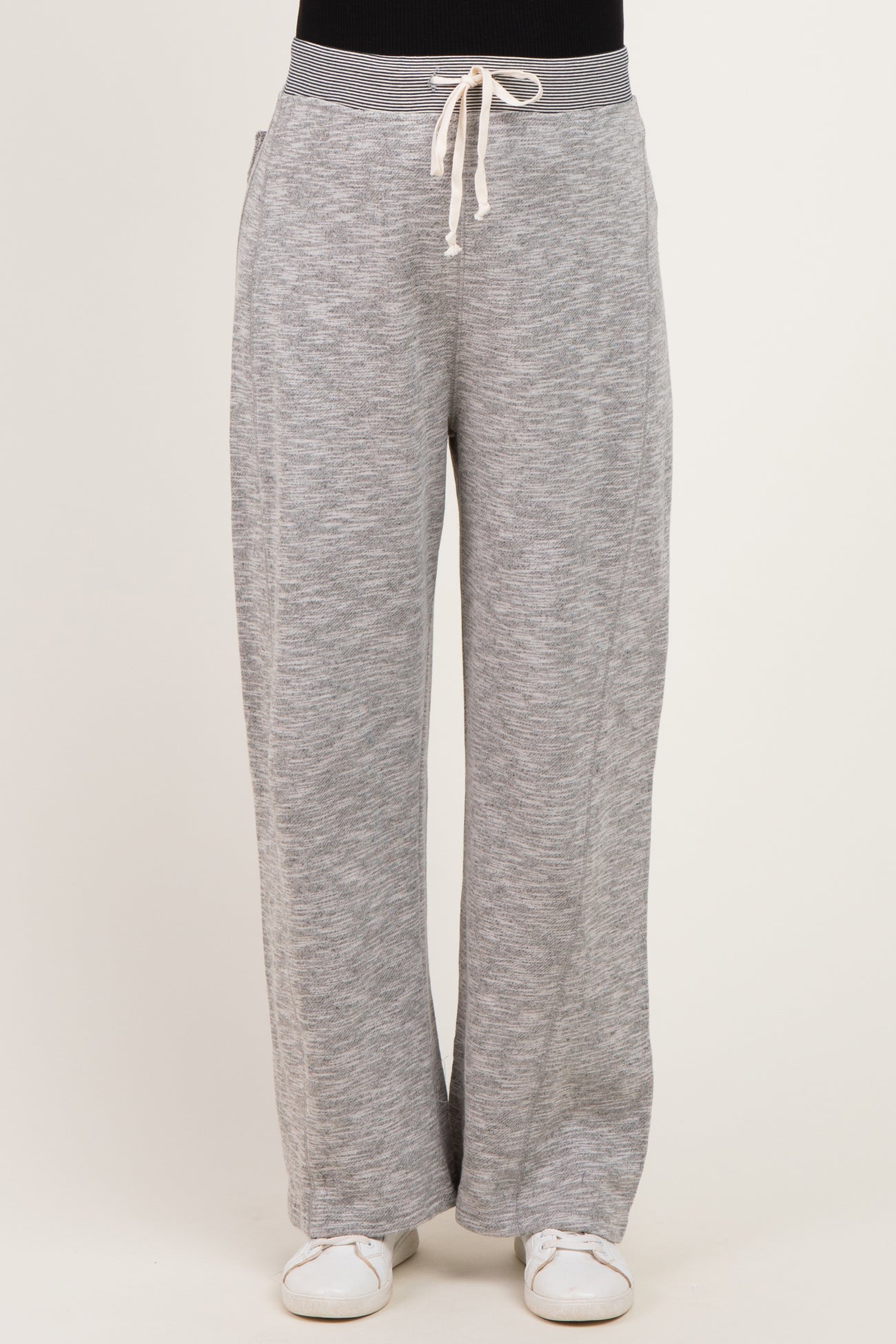 woman wearing gray maternity lounge pants with a drawstring waistband