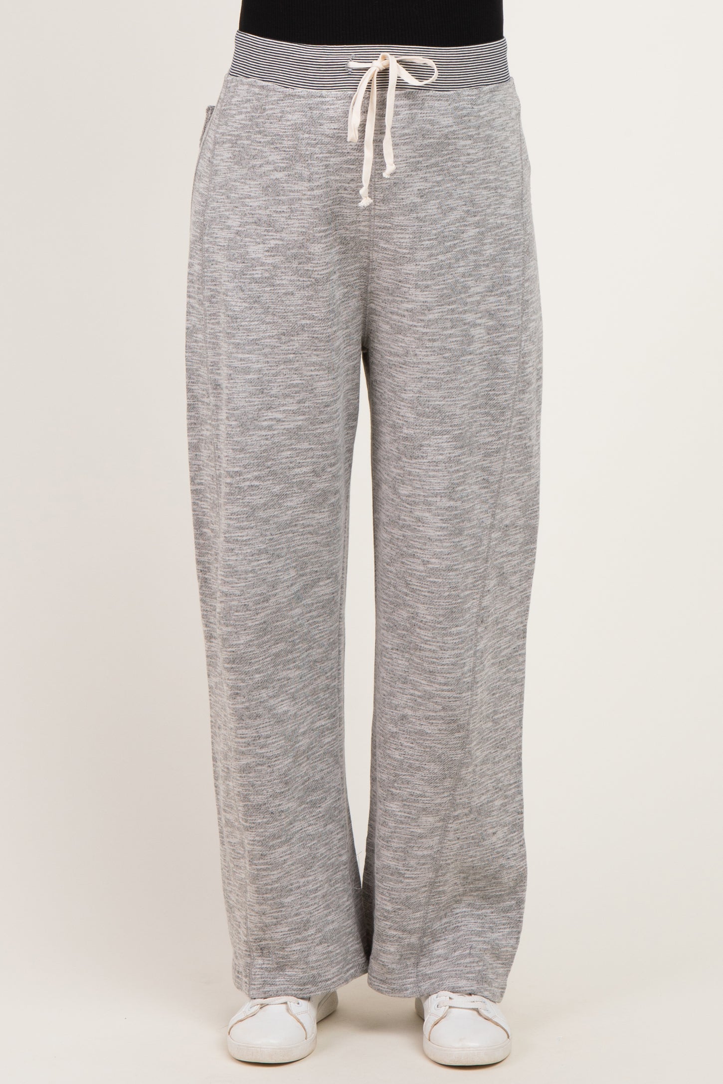 woman wearing gray maternity lounge pants with a drawstring waistband