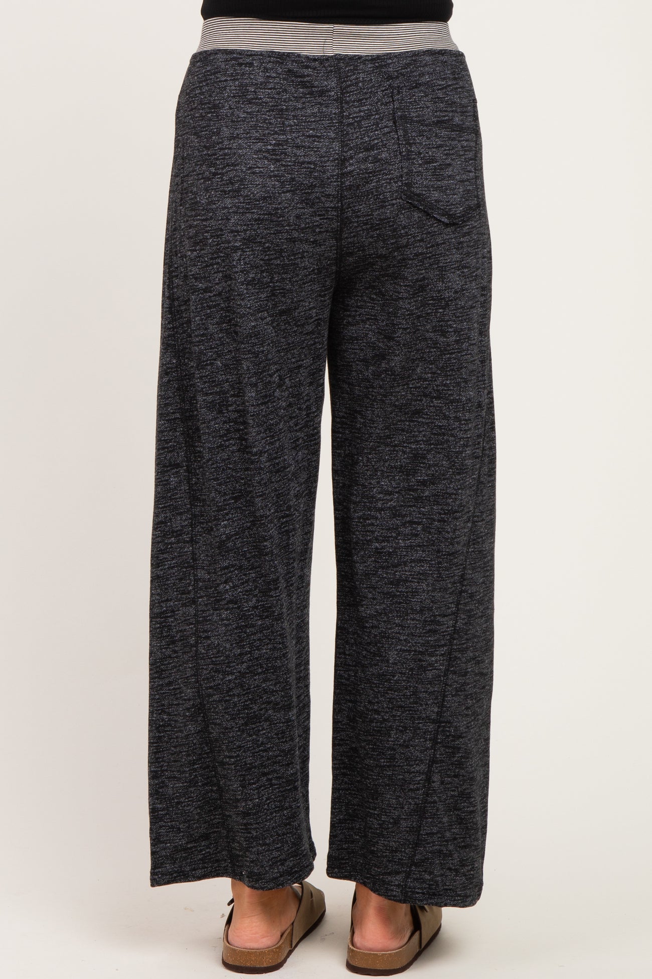 woman wearing dark gray wide-leg maternity pants viewed from the back