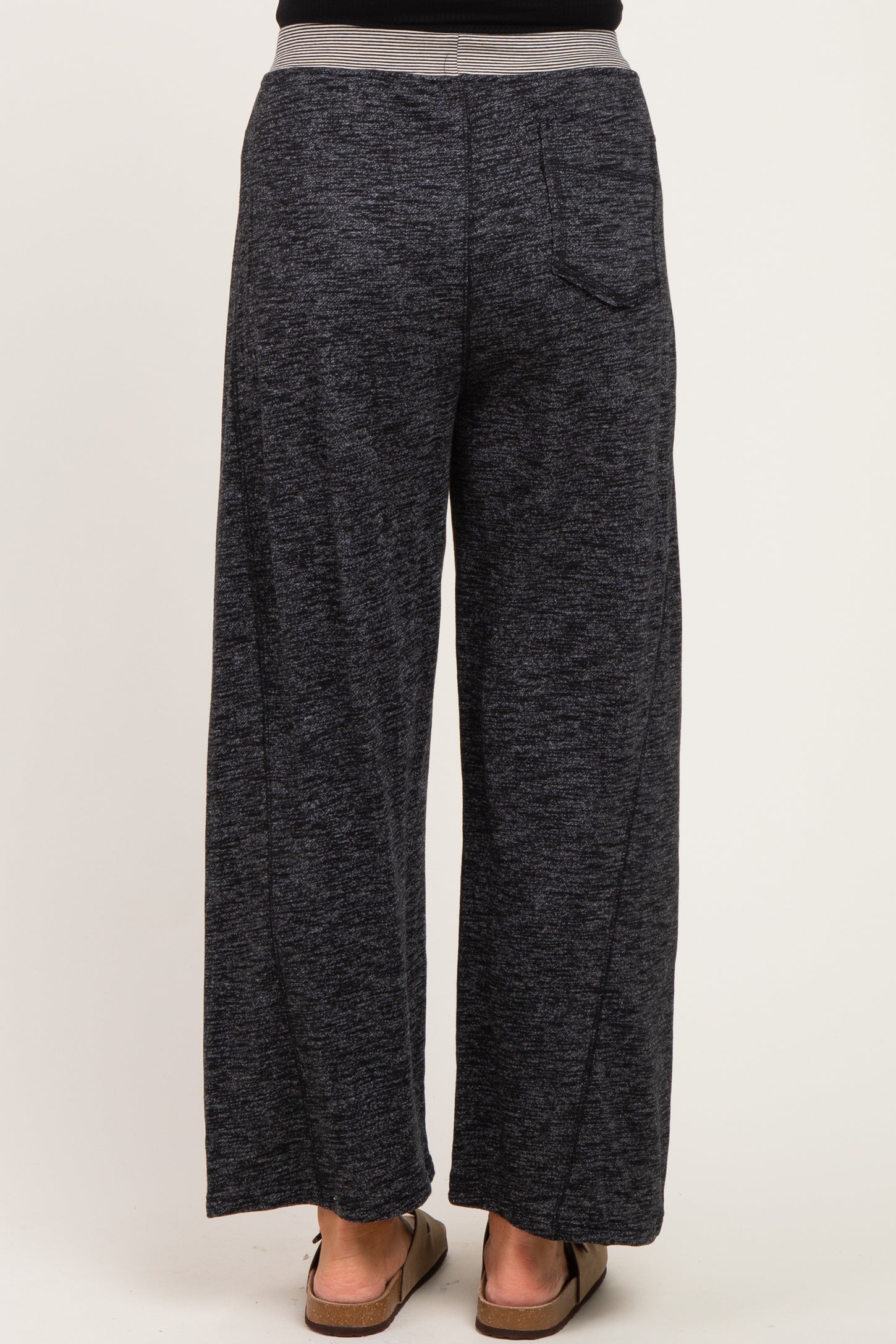 woman wearing dark gray wide-leg maternity pants viewed from the back