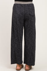 woman wearing dark gray wide-leg maternity pants viewed from the back