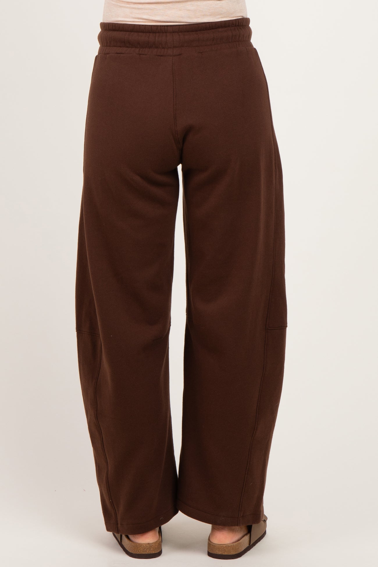 woman wearing brown maternity wide-leg sweatpants, view from the back