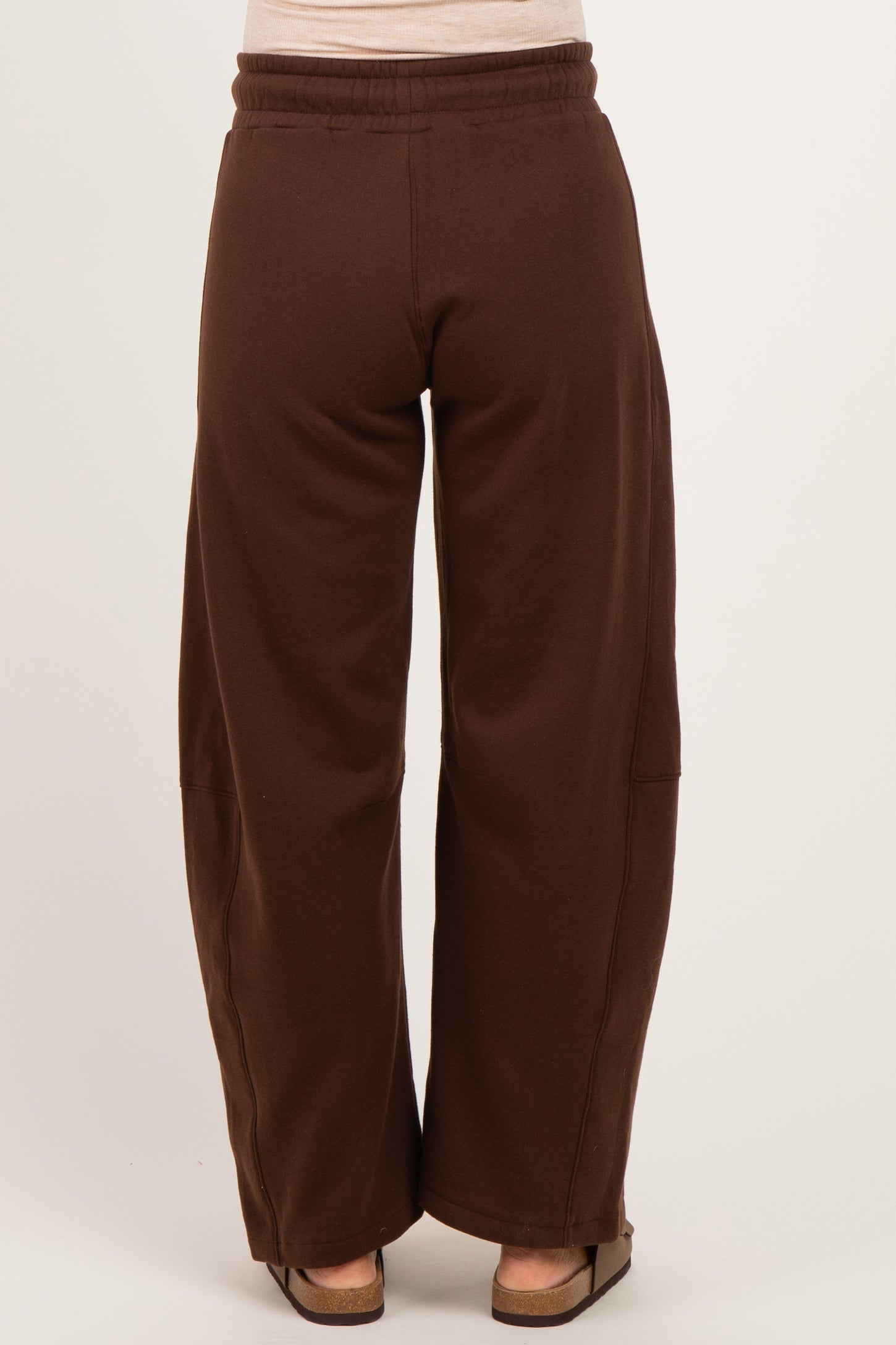 woman wearing brown maternity wide-leg sweatpants, view from the back