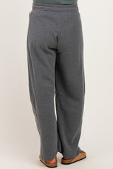 woman wearing gray maternity sweatpants, view of the back, relaxed fit and elastic waistband