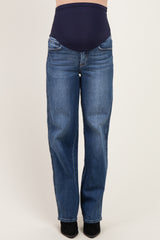 woman wearing dark blue maternity jeans with a supportive waistband and straight-leg fit