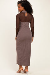 woman wearing a brown striped maxi dress with a mesh long sleeve top and keyhole back detail