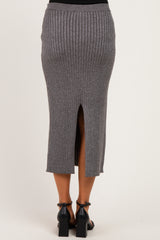 woman wearing a gray ribbed maternity midi skirt with a back slit detail