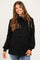 woman wearing a black maternity pullover sweatshirt with a cowl neck and drawstring detail, showing her baby bump