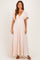 woman wearing a light pink maxi dress with flutter sleeves and a knotted front detail