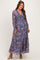 woman wearing a purple floral maternity maxi dress with long sleeves and a cinched waist, showcasing a baby bump