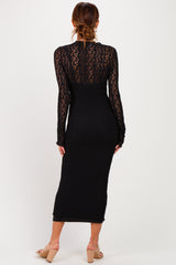 woman wearing a black long sleeve lace dress, showing intricate lace texture from the back