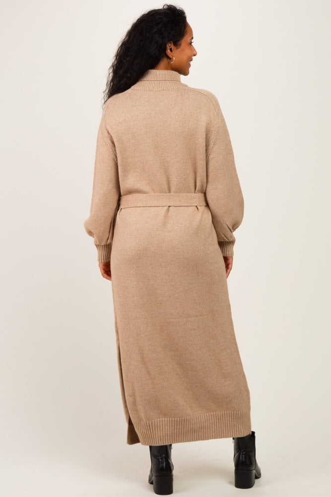 woman wearing a beige maternity long cardigan with a belted waist, viewed from the back