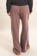 woman wearing mauve wide-leg lounge pants from the back