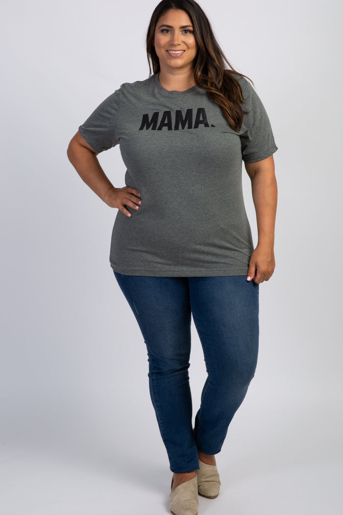 woman wearing a grey mama graphic t-shirt and blue jeans standing against a white background