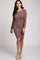 woman wearing a mauve long sleeve ribbed knit bodycon dress and tan pointed toe mules