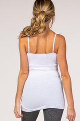woman wearing a white maternity tank top, showing a relaxed fit and adjustable straps from the back
