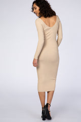 woman wearing a beige ribbed midi dress with a v-back and long sleeves, shown from the back