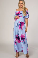 pregnant woman in light blue off the shoulder floral maternity maxi dress with pink and purple flowers