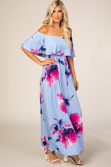 woman wearing light blue off the shoulder floral maxi dress with pink and purple flowers