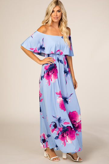 woman wearing light blue off the shoulder floral maxi dress with pink and purple flowers