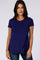 woman wearing a navy blue short sleeve top with an asymmetrical hem and a round neckline