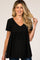 woman wearing a black short sleeve maternity top with a v-neck and a gathered waist, showing her baby bump