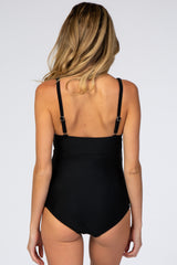 woman wearing a black maternity swimsuit showing the back with adjustable straps