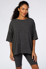woman wearing charcoal grey oversized pocket tee and matching biker shorts set