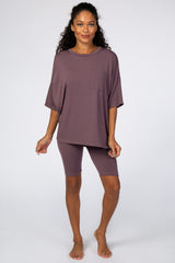 woman wearing a mauve oversized t-shirt with a pocket and matching bike shorts, casual loungewear look