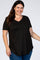 smiling woman wearing a black short sleeve v-neck maternity t-shirt and blue jeans