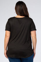 Back view of a woman with long brown hair wearing a basic black short sleeve t-shirt and blue jeans