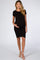 woman wearing a black short sleeve maternity dress and holding her baby bump
