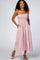woman wearing a pink and white gingham tiered maxi dress with spaghetti straps and side pockets