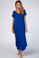 woman wearing a bright blue short sleeve maxi maternity dress with a v-neckline and relaxed fit