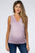 woman wearing a lavender maternity tank top with a crossover neckline and a visible baby bump