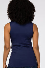 back view of a woman with curly hair wearing a navy blue sleeveless top