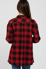woman wearing a red and black plaid flannel shirt, shown from the back, with long sleeves and a relaxed fit
