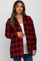 woman wearing a red and black plaid maternity shirt and holding her baby bump