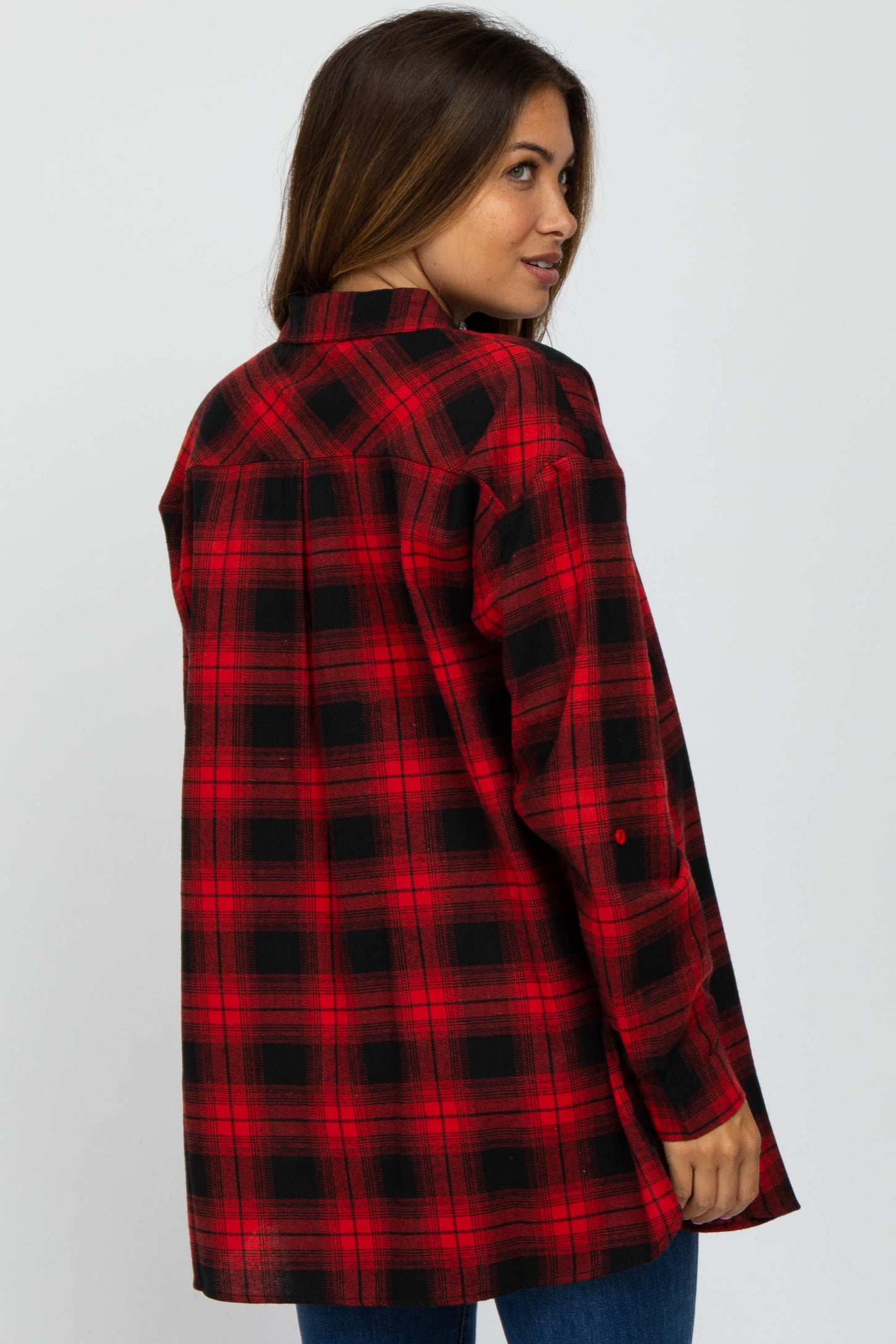 woman wearing a red and black plaid maternity shirt, visible baby bump, viewed from the back